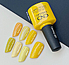 Shellac Catching Light לק ג'ל היפואלרגני בצבע צהוב חם עם זוהר מצצנץ